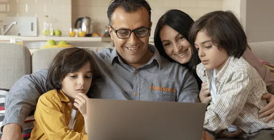 family-watching-laptop